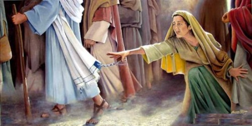 mujer tocando el manto de Jesucristo